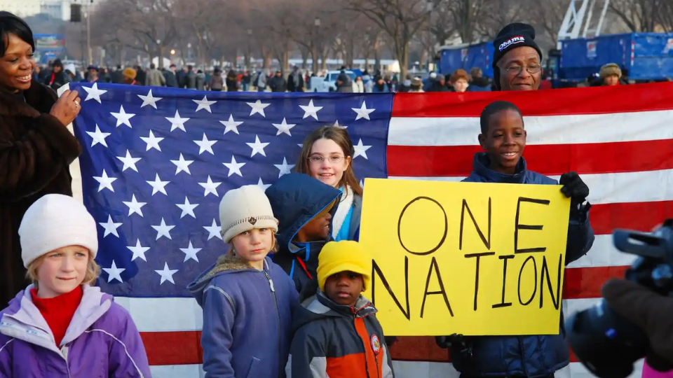 Image depicting children in front of an American flag.