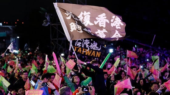 Hong Kong anti-government protesters attend a rally in support of Taiwan President Tsai Ing-wen outside the Democratic Progressive Party (DPP) headquarters in Taipei, Taiwan