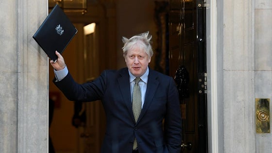 Britains Prime Minister Boris Johnson waves after delivering a statement at Downing Street following winning the general election, in London, Britain.