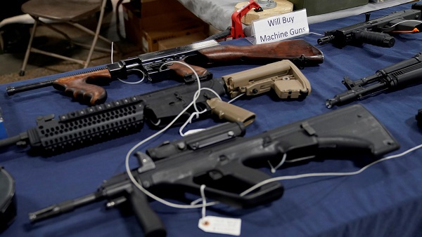 Fully automatic machine guns are displayed for sale at the Guntoberfest gun show in Oaks, Pennsylvania.