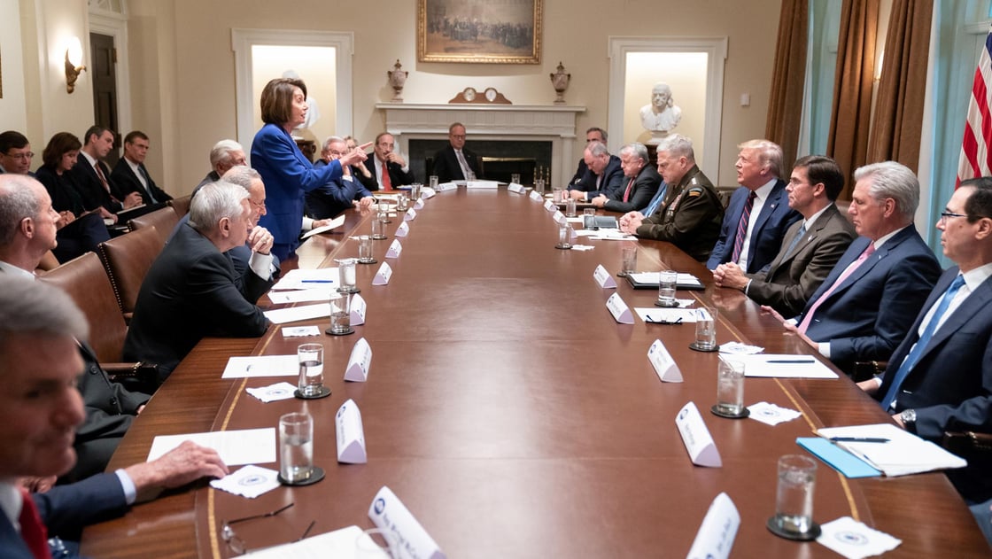 Speaker of the House Nancy Pelosi stands and speaks to U.S. President Donald Trump during an October 16 meeting about Syria.