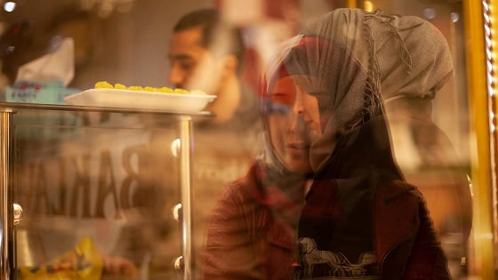 Syrian refugees in Turkey visit a pastry shop.