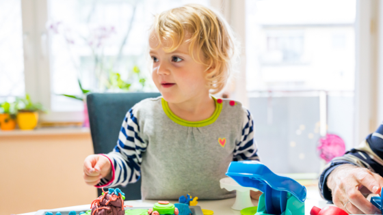 Child plays with modeling clay