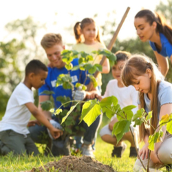 Children in garden with teachers.