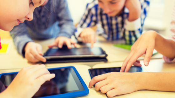 Children learning with tablets