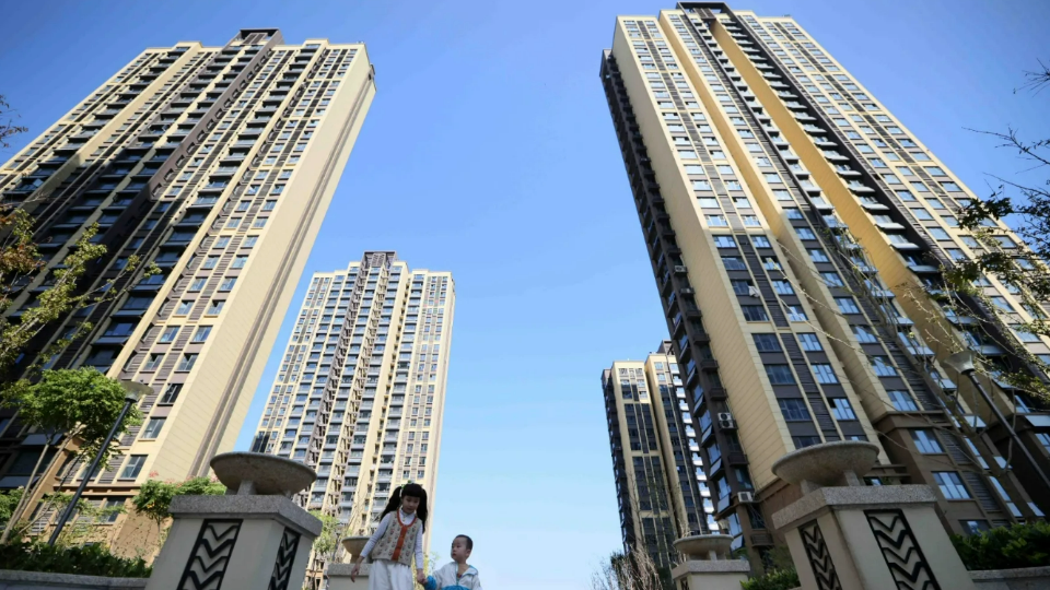 Children play in a residential area at a housing project in Hefei, Anhui province, China