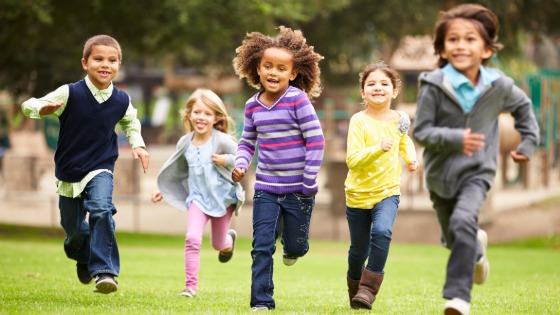 Children running through a field