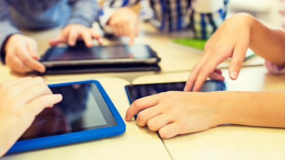 Children use electronic tablets at school