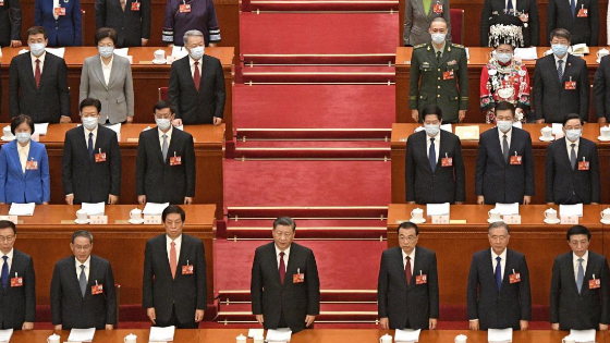 Chinese President Xi Jinping and others sing the national anthem during the opening ceremony of the National Peoples Congress.