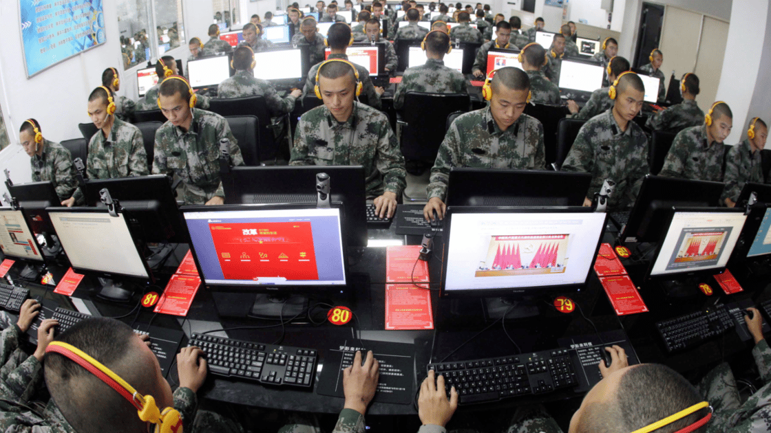 Chinese soldiers browse online news on desktop computers at a garrison of the PLA