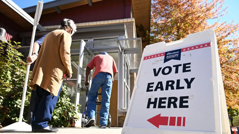 Citizens visit a venue for early voting in Asheville, North Carolina on October 25, 2024