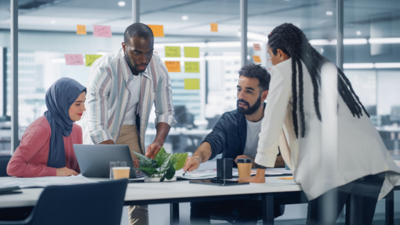 Colleagues collaborate in office meeting