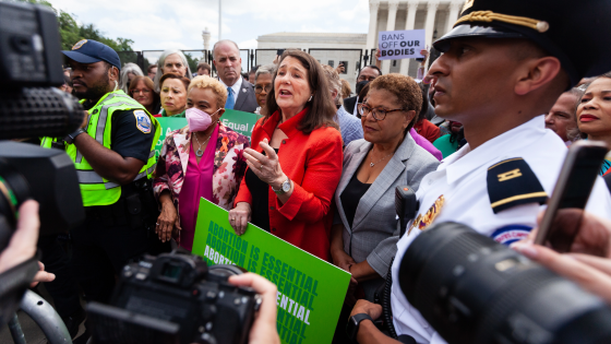 Congresswoman Diane DeGette speaks with reporters while surrounded by pro-choice Congresswomen at the Supreme Court