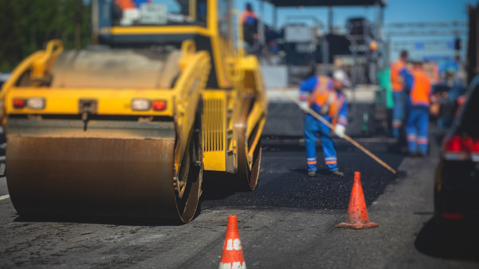 Construction workers on a highway project.