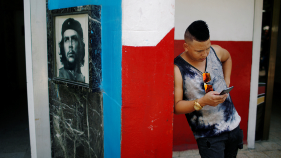 Cuban resident uses his smartphone