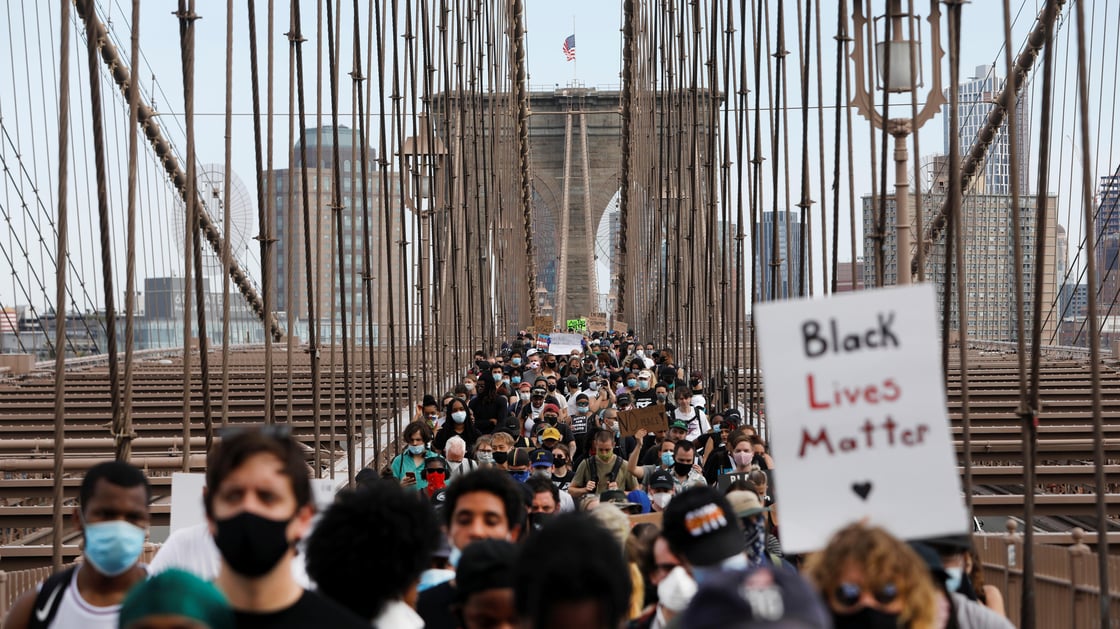 Demonstrators march across Brooklyn Bridge in protest against the death in Minneapolis police custody of George Floyd