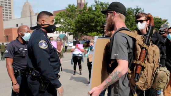 Detriot police officers confront two armed men