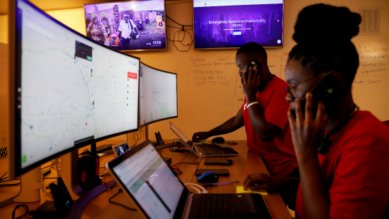 Dispatchers for the Rescue.co free ambulance service look at computer screens during the coronavirus night curfew in Nairobi