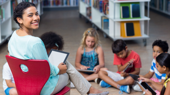 Early childhood instructor with tablet