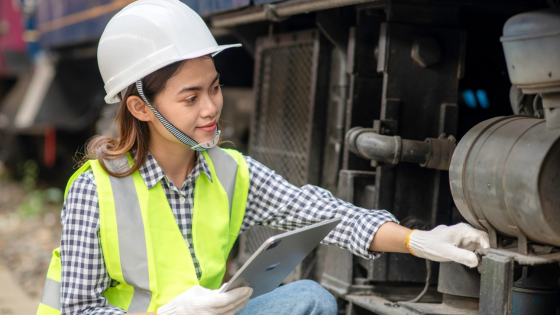 Engineer wearing protective gear performs inspection