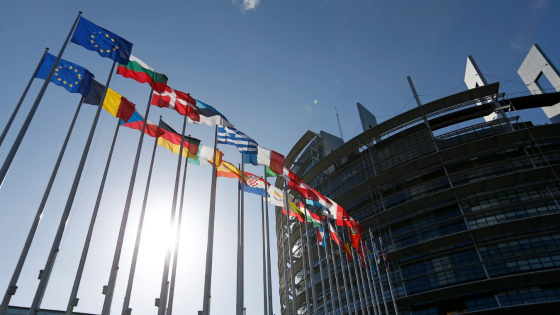 European parliament building with flags flying outside