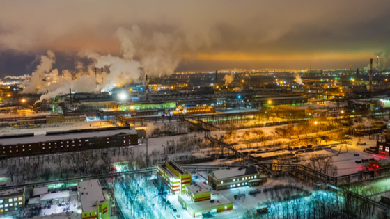 Evening view of smoke billowing from an industrial zone