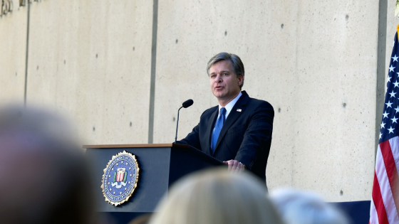 FBI Director Christopher Wray speaks at podium