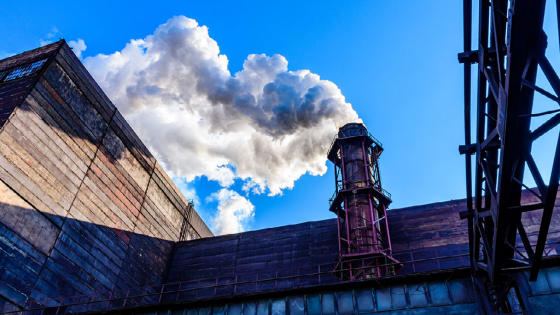 Factory smoke against sky