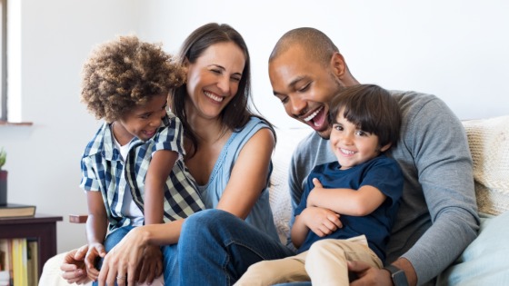 Family sitting on sofa