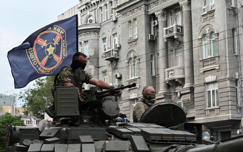 Fighters of Wagner private mercenary group are seen atop of a tank while being deployed near the headquarters of the Southern Military District in the city of Rostov-on-Don, Russia.