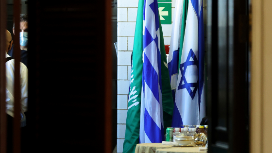 Flags of Saudi Arabia and Israel stand together in a kitchen staging area as U.S. Secretary of State Antony Blinken holds meetings at the State Department