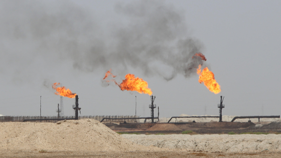 Flames emerge from the flare stacks at the West Qurna-1 oilfield