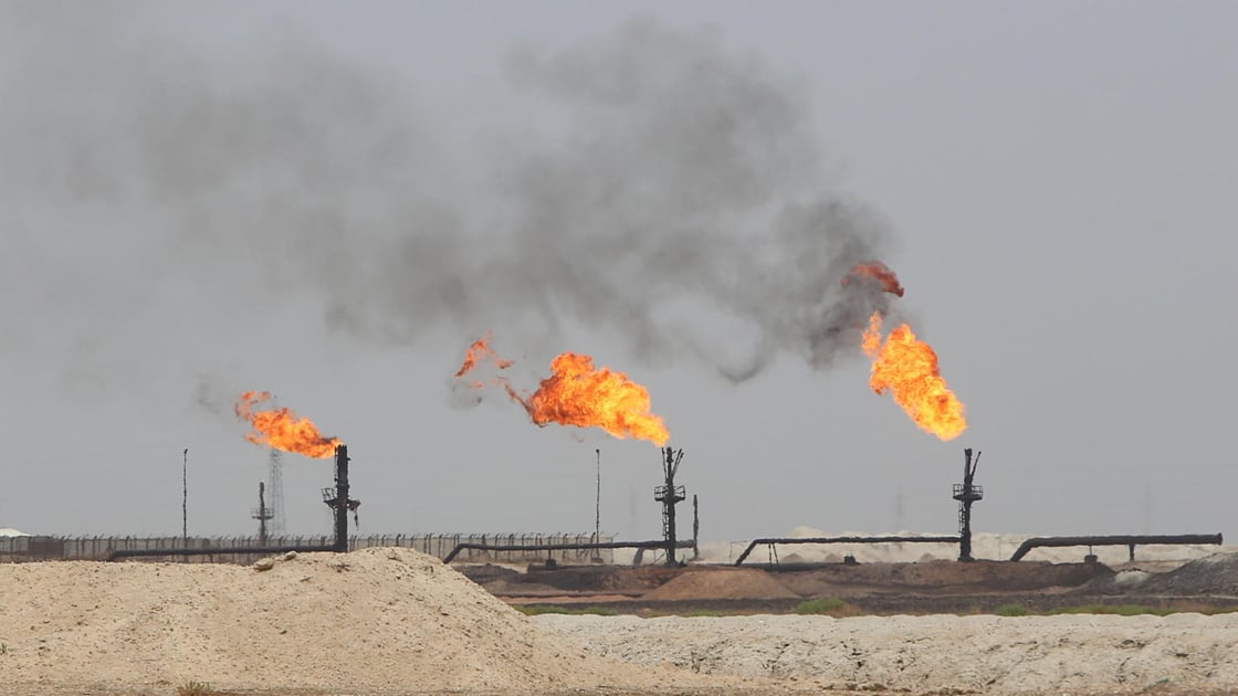 Flames emerge from the flare stacks at the West Qurna1 oilfield