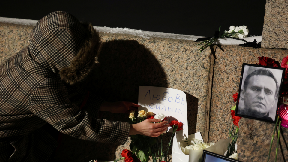 Flowers and portraits of Russian opposition leader Alexei Navalny are placed at the monument to the victims of political repressions following his death, in Saint Petersburg, Russia