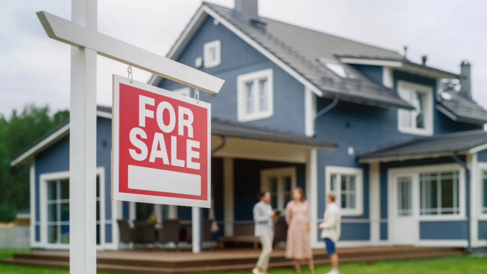 For sale sign shown outside of house