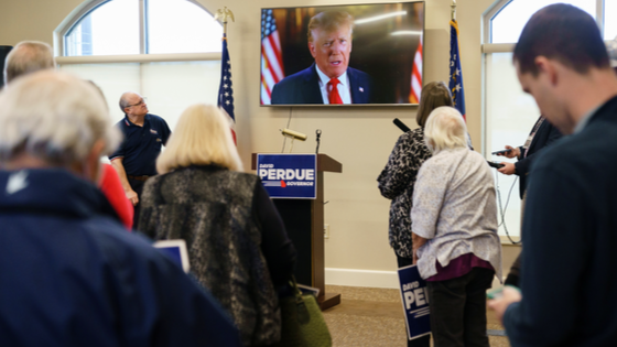 Former U.S. President Donald Trump appears in a video endorsing former Republican U.S. Senator David Perdue