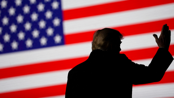 Former U.S. President Donald Trump gestures during a rally in Conroe