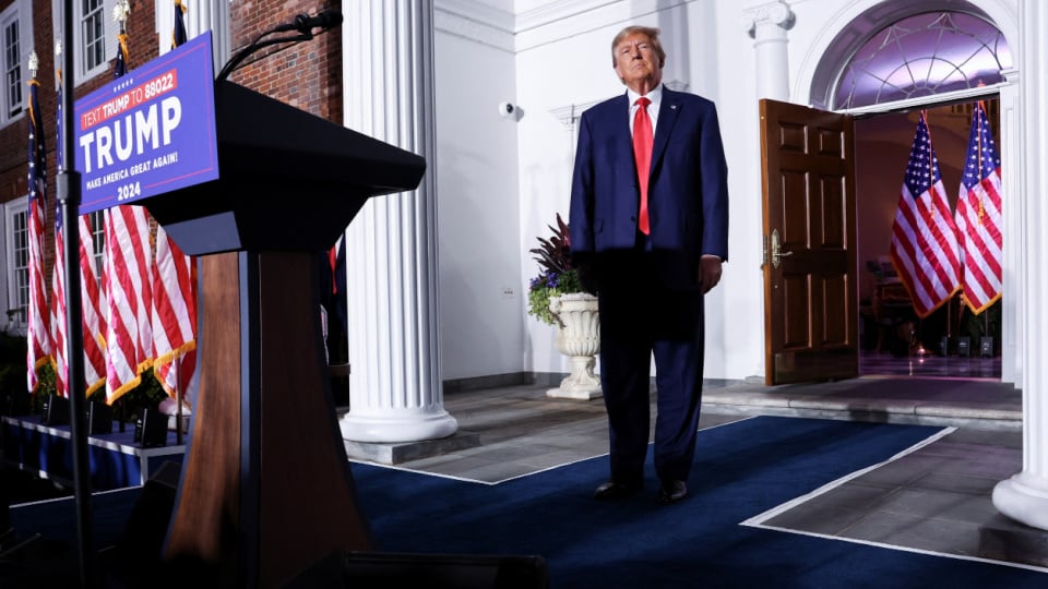 Former U.S. President Donald Trump walks onstage during an event following his arraignment on classified document charges.