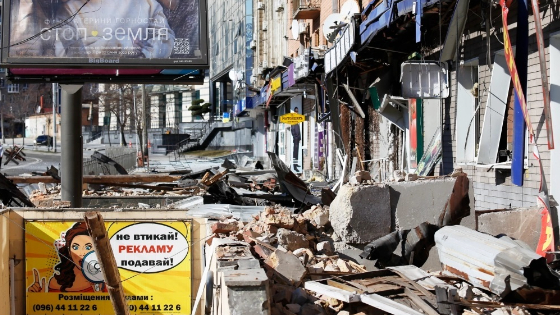 General view of a street in Ukraine damaged residential building and shops that was hit by a Russian shell.