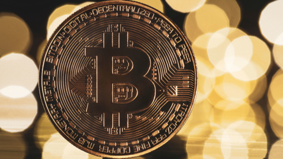 Golden bitcoin with yellow background