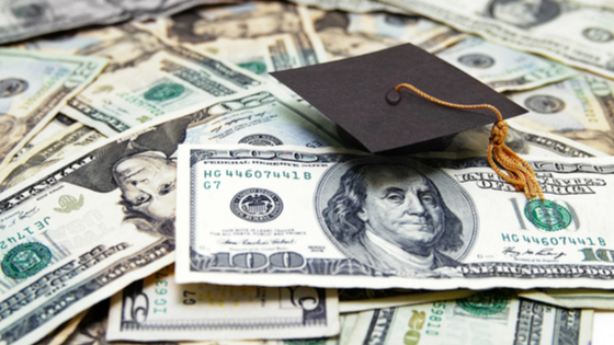 Graduation hats and U.S. dollars.