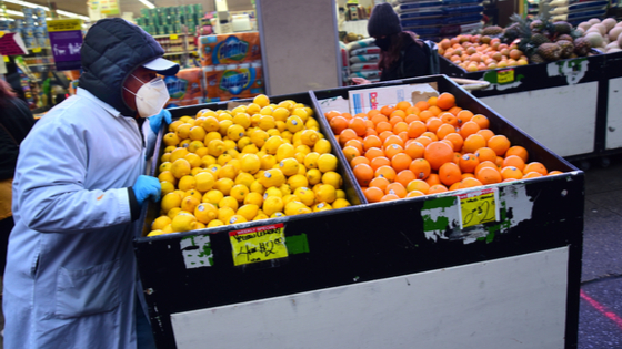 Grocery store worker in New York City, NY.