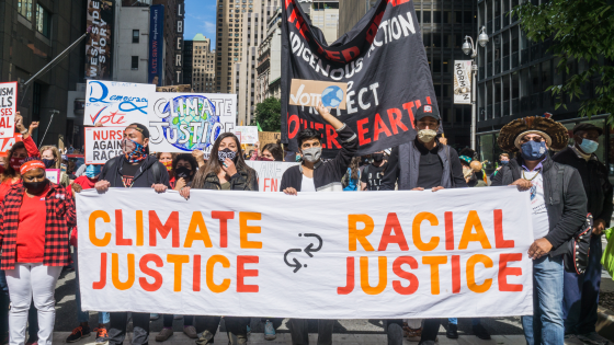 Group of activists for climate justice and racial justice marching the streets of New York City