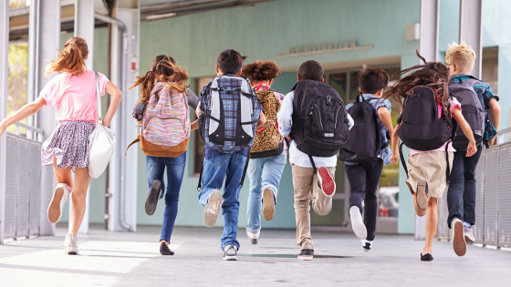 Group of children running at an elementary school