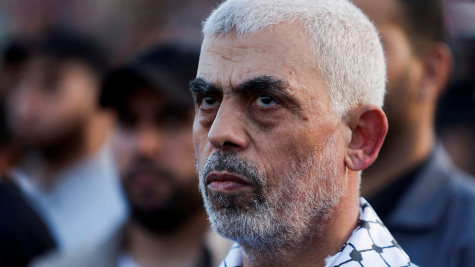 Hamas leader Yahya Sinwar looks on as Palestinian Hamas supporters take part in an anti-Israel rally.