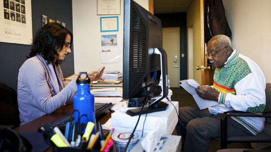 Hamson McPherson looks over paper work from Wells Fargo regarding a denied loan modification request for his mortgage with Shabnam Faruki