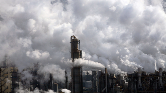 Heavy smoke is discharged from chimneys at an ethylene plant