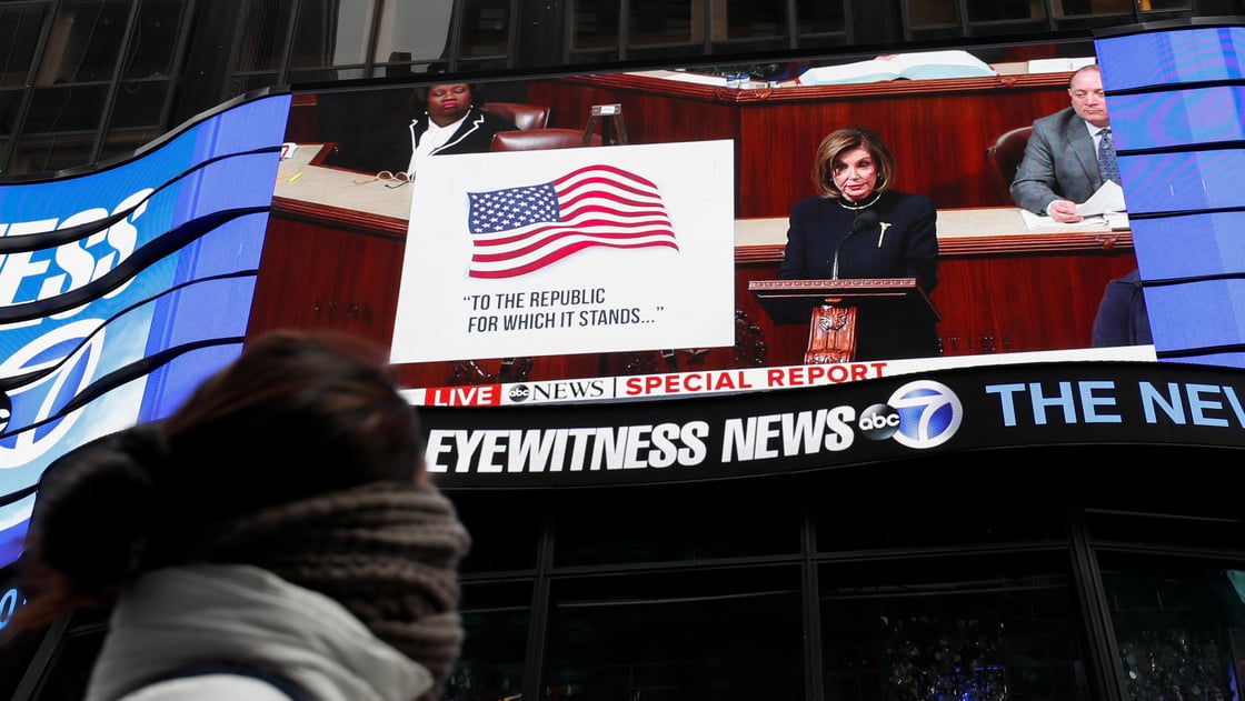 House Speaker Nancy Pelosi (D-CA) is seen on a jumbotron outside ABC News studios speaking to the U.S. House of Representatives during the session to discuss rules ahead of a vote on two articles of im