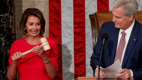 House Speaker-designate Nancy Pelosi (D-CA) is handed the gavel by House Republican Leader Kevin McCarthy (R-CA)