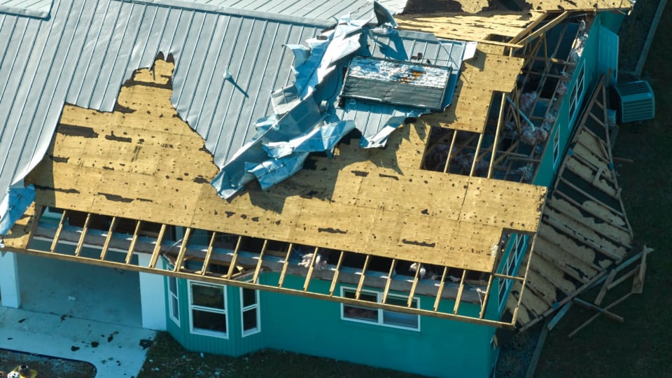 Hurricane Ian destroyed house in Florida residential area.